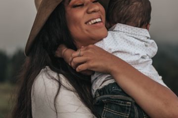 woman hugging baby