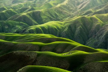 bird's eye view photograph of green mountains