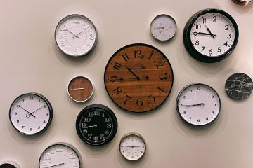 white and brown analog wall clock at 10 00